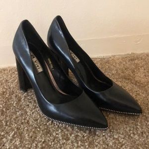 Black studded heel pumps
